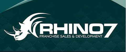 Rhino7 logo featuring a green rhinoceros illustration and black and green lettering with the tagline Franchise Sales & Development.